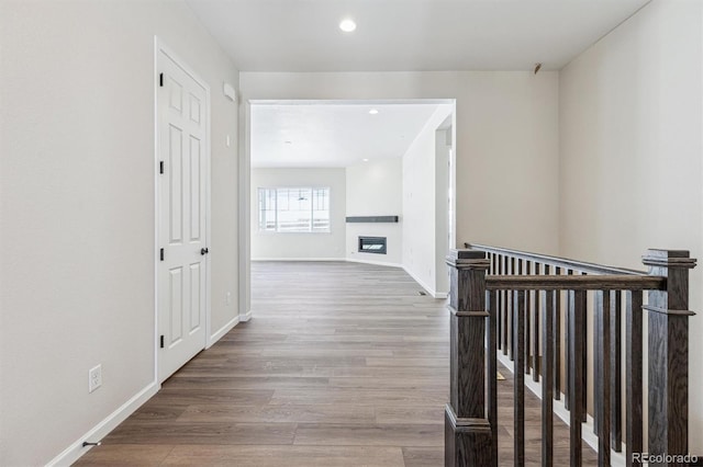 corridor featuring hardwood / wood-style floors