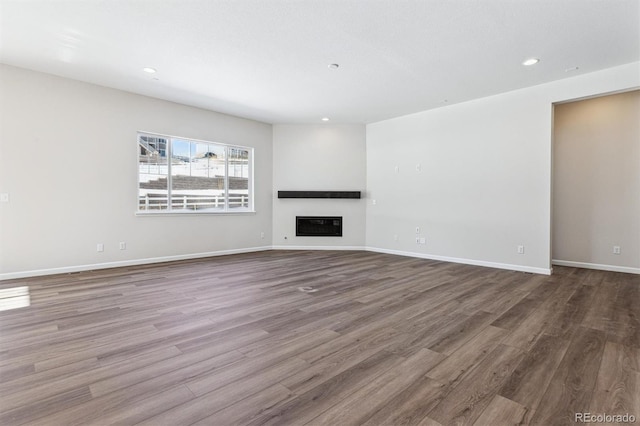 unfurnished living room featuring hardwood / wood-style floors