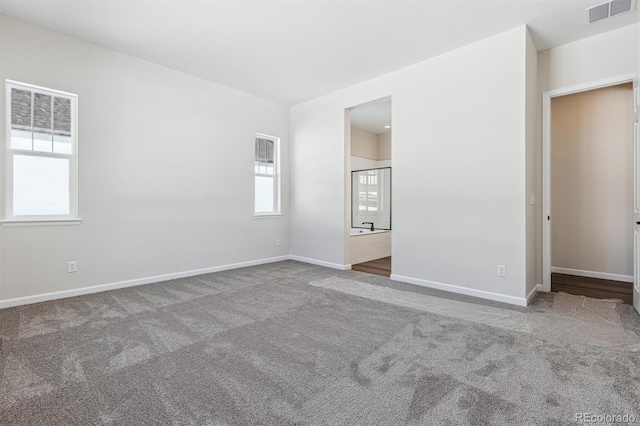 unfurnished bedroom with carpet floors