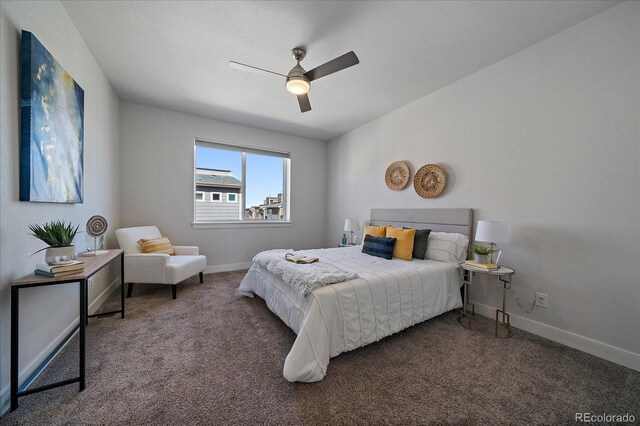 bedroom featuring a ceiling fan, carpet, and baseboards