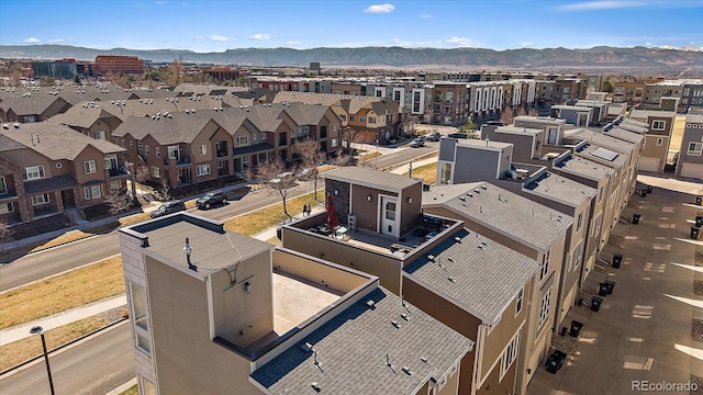 drone / aerial view featuring a mountain view and a residential view