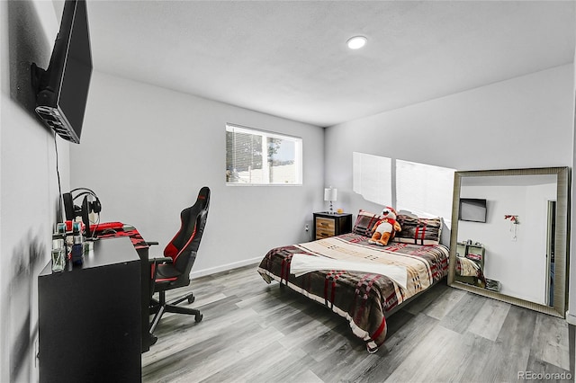 bedroom with light hardwood / wood-style flooring