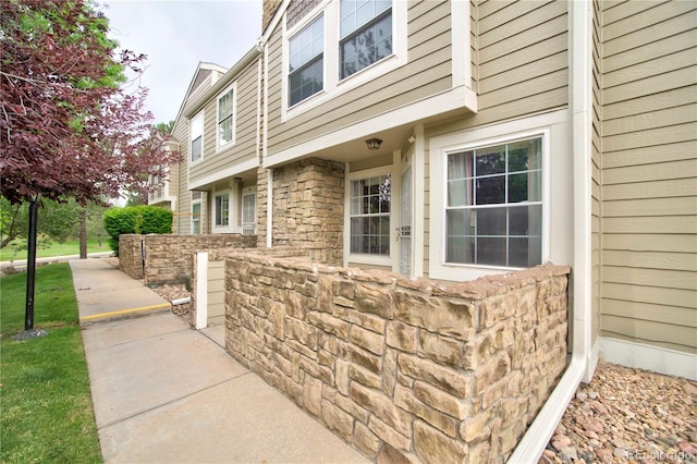 210 W Jamison Cir Unit 41, Littleton, CO 80120 - doorway to property featuring stone siding
