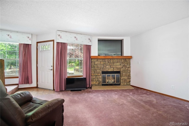 210 W Jamison Cir Unit 41, Littleton, CO 80120 - living area featuring carpet floors, a textured ceiling, and a stone fireplace