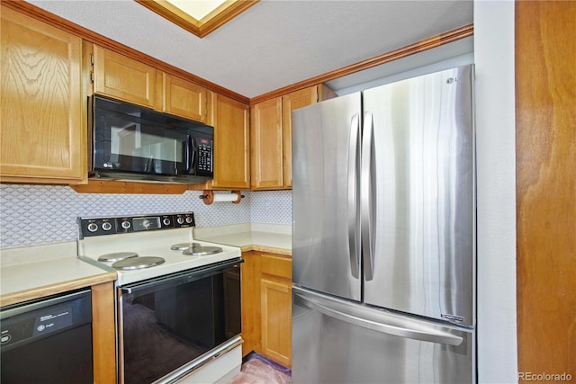 210 W Jamison Cir Unit 41, Littleton, CO 80120 - kitchen featuring black appliances, light countertops, and tasteful backsplash