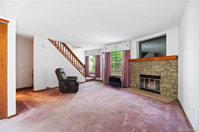 210 W Jamison Cir Unit 41, Littleton, CO 80120 - unfurnished living room featuring stairs, carpet floors, and a fireplace