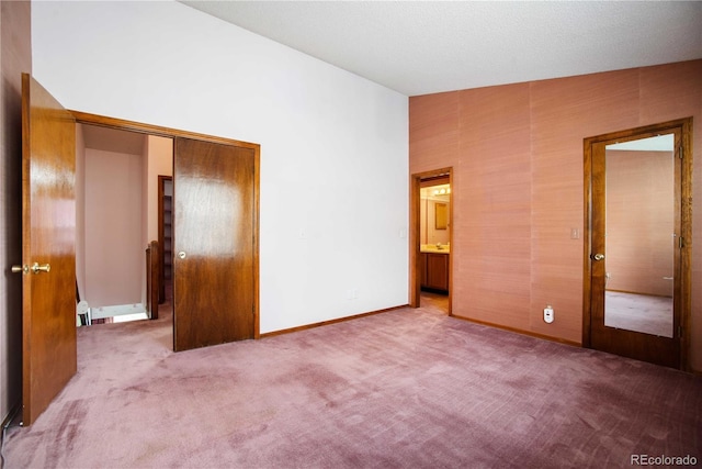 210 W Jamison Cir Unit 41, Littleton, CO 80120 - unfurnished bedroom featuring carpet and vaulted ceiling