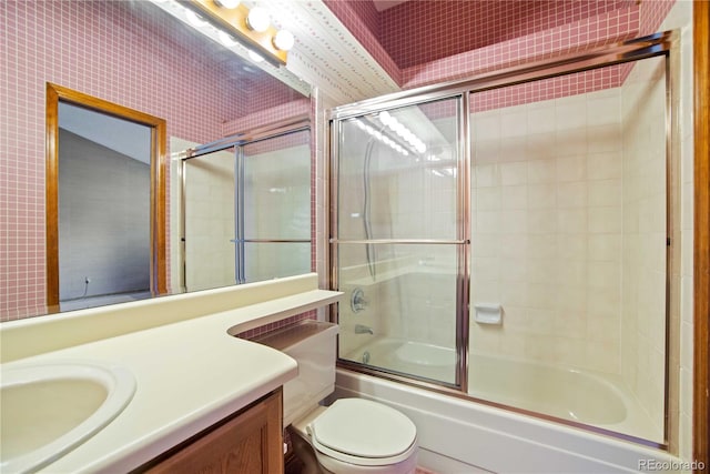 210 W Jamison Cir Unit 41, Littleton, CO 80120 - full bathroom with vanity, shower / bath combination with glass door, and wallpapered walls