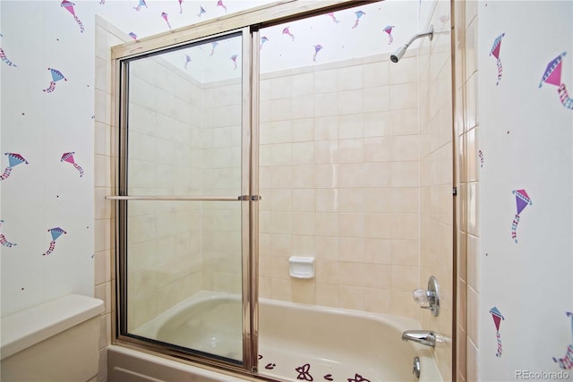 210 W Jamison Cir Unit 41, Littleton, CO 80120 - bathroom featuring toilet and shower / bath combination with glass door