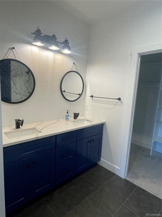 bathroom with tile patterned floors and vanity