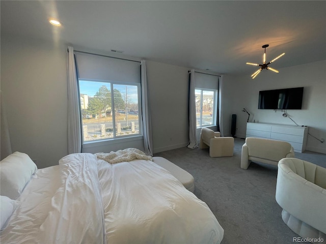 bedroom with carpet flooring and an inviting chandelier