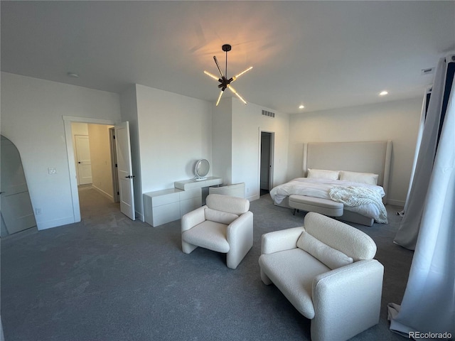 bedroom featuring a chandelier and dark colored carpet