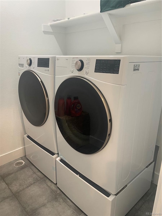 laundry room with washer and dryer