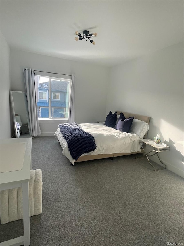 bedroom featuring dark carpet