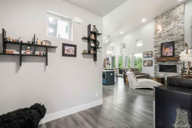 3630 Mesa Verde Rd, Monument, CO 80132 - living room featuring a fireplace, dark wood-type flooring, a high ceiling, and recessed lighting
