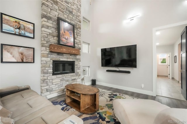 3630 Mesa Verde Rd, Monument, CO 80132 - living room with wood finished floors, a fireplace, and a high ceiling