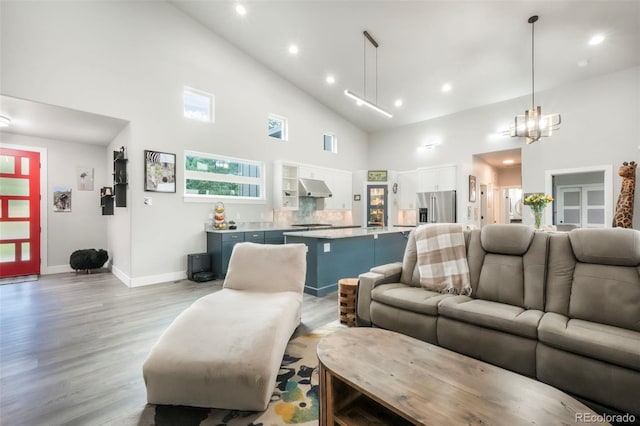 3630 Mesa Verde Rd, Monument, CO 80132 - living room featuring high vaulted ceiling, light wood-type flooring, and recessed lighting