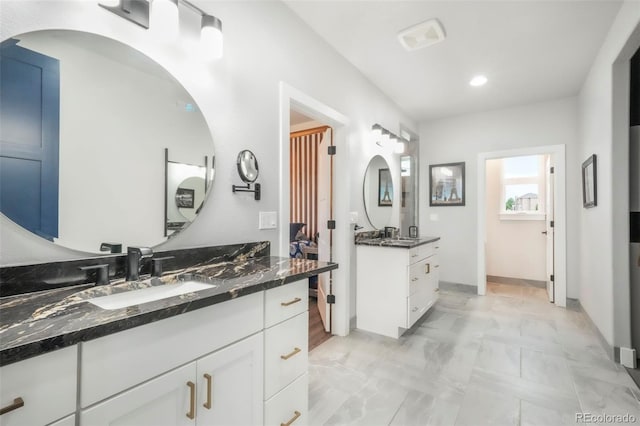 3630 Mesa Verde Rd, Monument, CO 80132 - full bath with two vanities, recessed lighting, and marble finish flooring