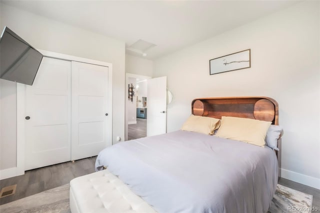 3630 Mesa Verde Rd, Monument, CO 80132 - bedroom featuring a closet, wood finished floors, and attic access