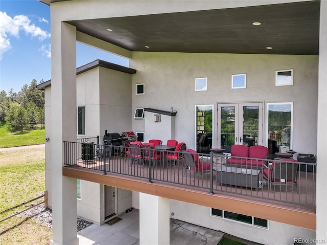 3630 Mesa Verde Rd, Monument, CO 80132 - back of property featuring an outdoor hangout area and stucco siding