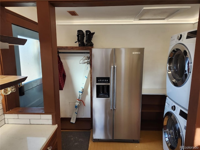 washroom with stacked washer / dryer