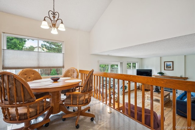5513 S Yank Ct, Littleton, CO 80127 - dining space featuring healthy amount of natural light, a chandelier, lofted ceiling, and a desk