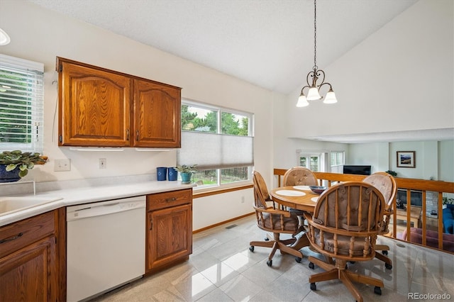 5513 S Yank Ct, Littleton, CO 80127 - kitchen with dishwasher, brown cabinetry, light countertops, decorative light fixtures, and a chandelier