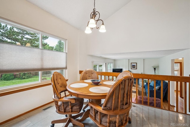 5513 S Yank Ct, Littleton, CO 80127 - dining space featuring high vaulted ceiling, a chandelier, and tile patterned floors