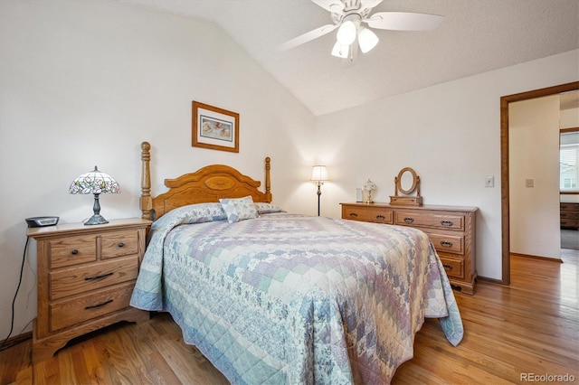 5513 S Yank Ct, Littleton, CO 80127 - bedroom with light wood-type flooring, lofted ceiling, and ceiling fan