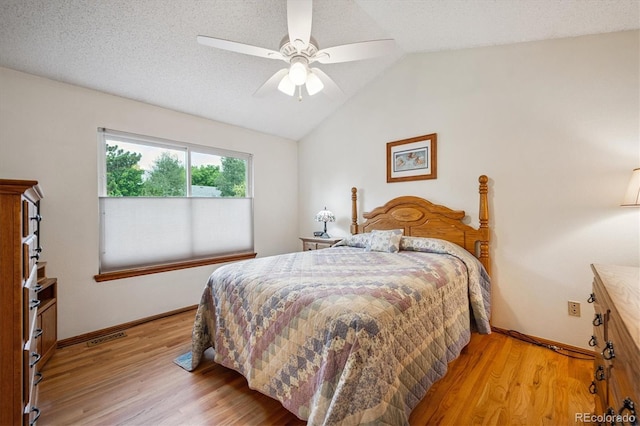 5513 S Yank Ct, Littleton, CO 80127 - bedroom with light wood-type flooring, vaulted ceiling, and a ceiling fan
