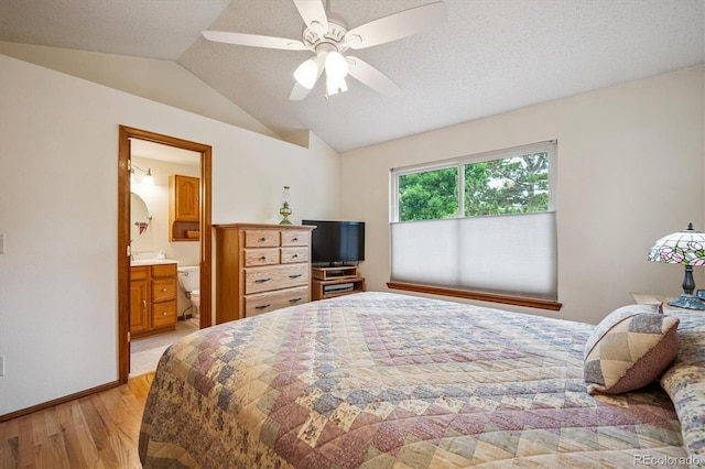5513 S Yank Ct, Littleton, CO 80127 - bedroom featuring light wood-style flooring, lofted ceiling, ensuite bathroom, and ceiling fan