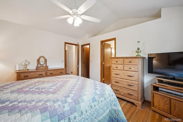5513 S Yank Ct, Littleton, CO 80127 - bedroom with light wood-type flooring, lofted ceiling, and a ceiling fan