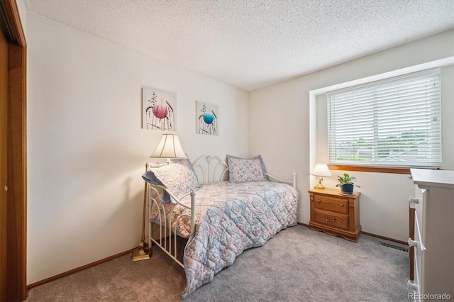 5513 S Yank Ct, Littleton, CO 80127 - bedroom featuring carpet and a textured ceiling
