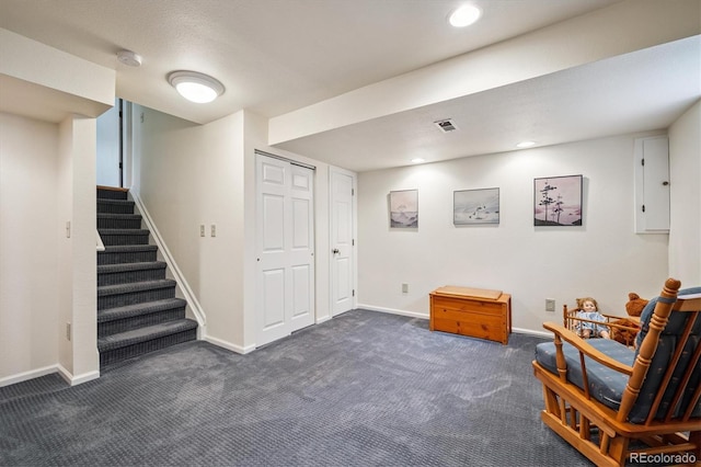 5513 S Yank Ct, Littleton, CO 80127 - living area with dark carpet, stairway, and recessed lighting