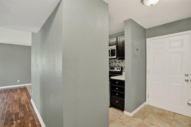10211 Ura Ln Unit 208, Thornton, CO 80260 - hall with baseboards and electric panel