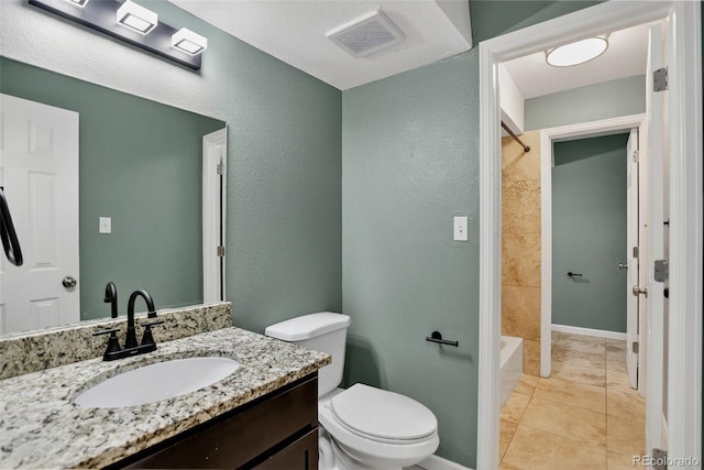 10211 Ura Ln Unit 208, Thornton, CO 80260 - bathroom with vanity, a textured wall, bathtub / shower combination, and tile patterned floors