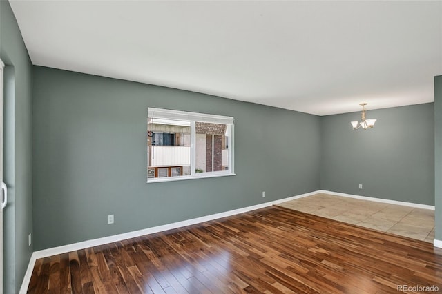 10211 Ura Ln Unit 208, Thornton, CO 80260 - unfurnished room featuring a chandelier and hardwood / wood-style floors
