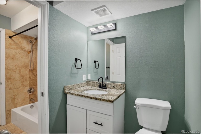 10211 Ura Ln Unit 208, Thornton, CO 80260 - bathroom featuring a textured wall, vanity, and bathing tub / shower combination