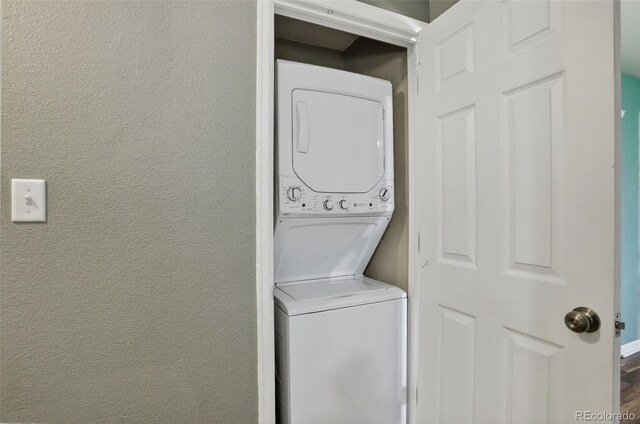 10211 Ura Ln Unit 208, Thornton, CO 80260 - laundry room with stacked washing machine and dryer