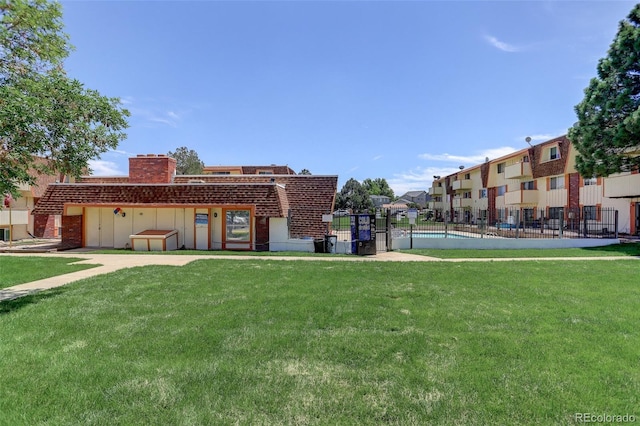 10211 Ura Ln Unit 208, Thornton, CO 80260 - rear view of property featuring a chimney