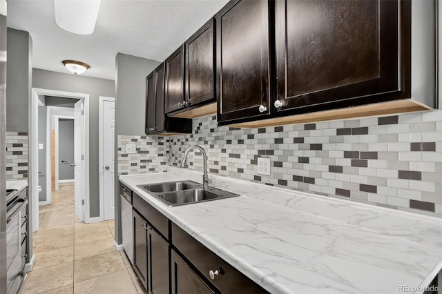 10211 Ura Ln Unit 208, Thornton, CO 80260 - kitchen featuring appliances with stainless steel finishes, backsplash, and dark brown cabinets