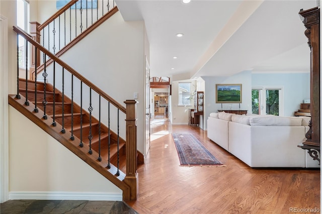 entryway with hardwood / wood-style floors