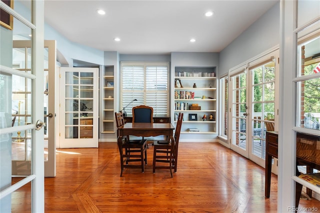 dining room with parquet flooring and french doors