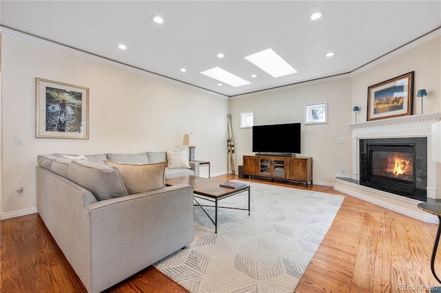 living room with crown molding and light wood-type flooring