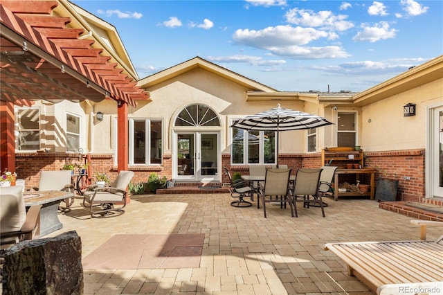 view of patio / terrace featuring a pergola and french doors