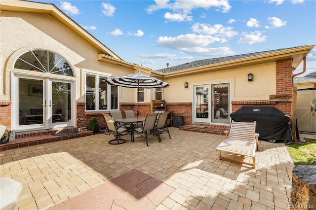 view of patio / terrace with french doors and a grill