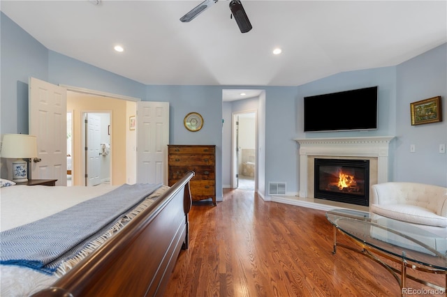 bedroom with lofted ceiling, wood-type flooring, and ceiling fan