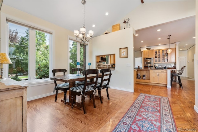 2400 S Clayton St, Denver, CO 80210 - dining space with baseboards, plenty of natural light, a chandelier, lofted ceiling, and recessed lighting