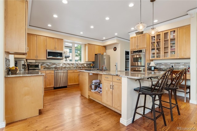 2400 S Clayton St, Denver, CO 80210 - kitchen with appliances with stainless steel finishes, crown molding, light brown cabinetry, backsplash, and light stone counters