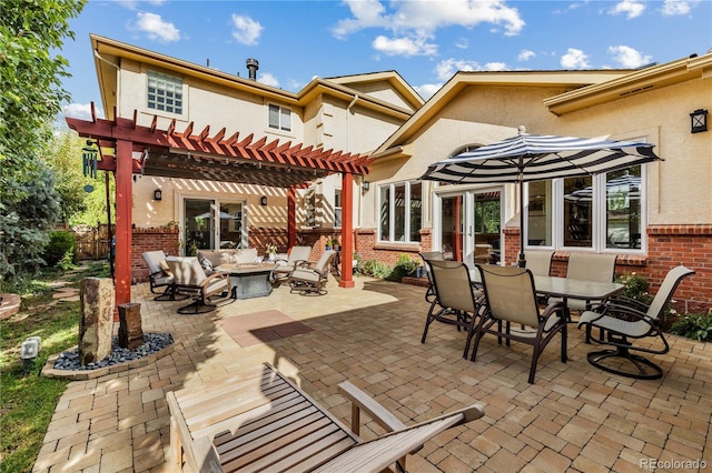 2400 S Clayton St, Denver, CO 80210 - back of house with a pergola, brick siding, stucco siding, a patio area, and outdoor dining area